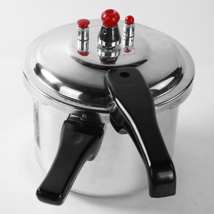 Pressure cooker with a silver lid and black handles on a white background