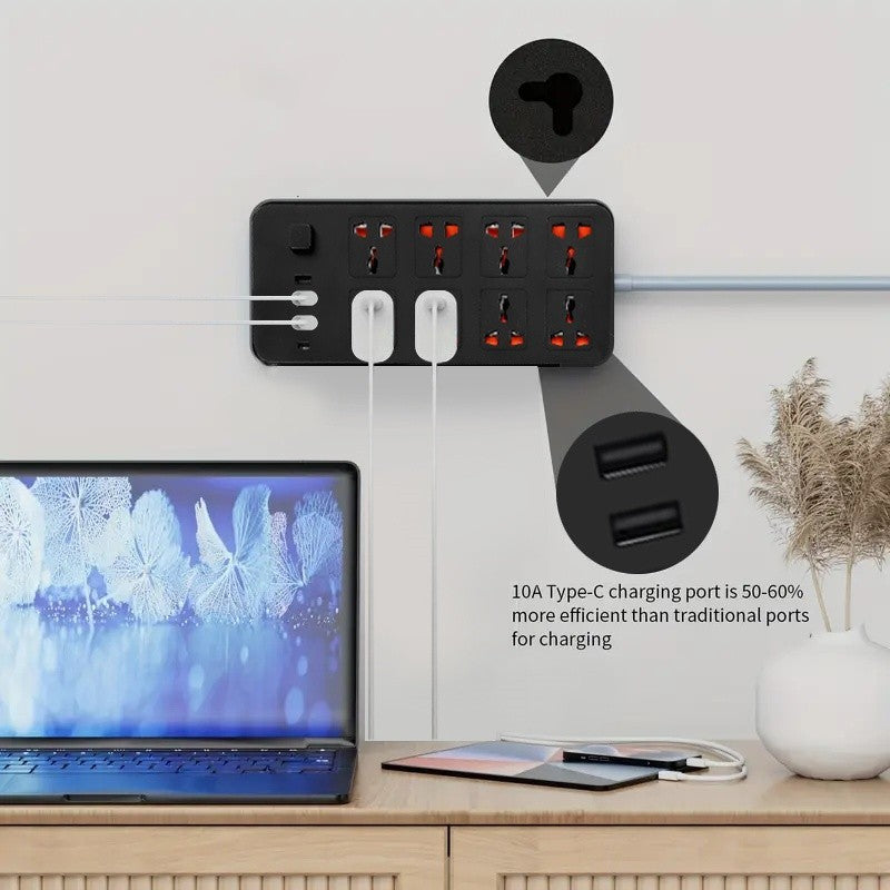 Wall-mounted power strip with multiple outlets and USB ports, connected to a laptop on a wooden surface.