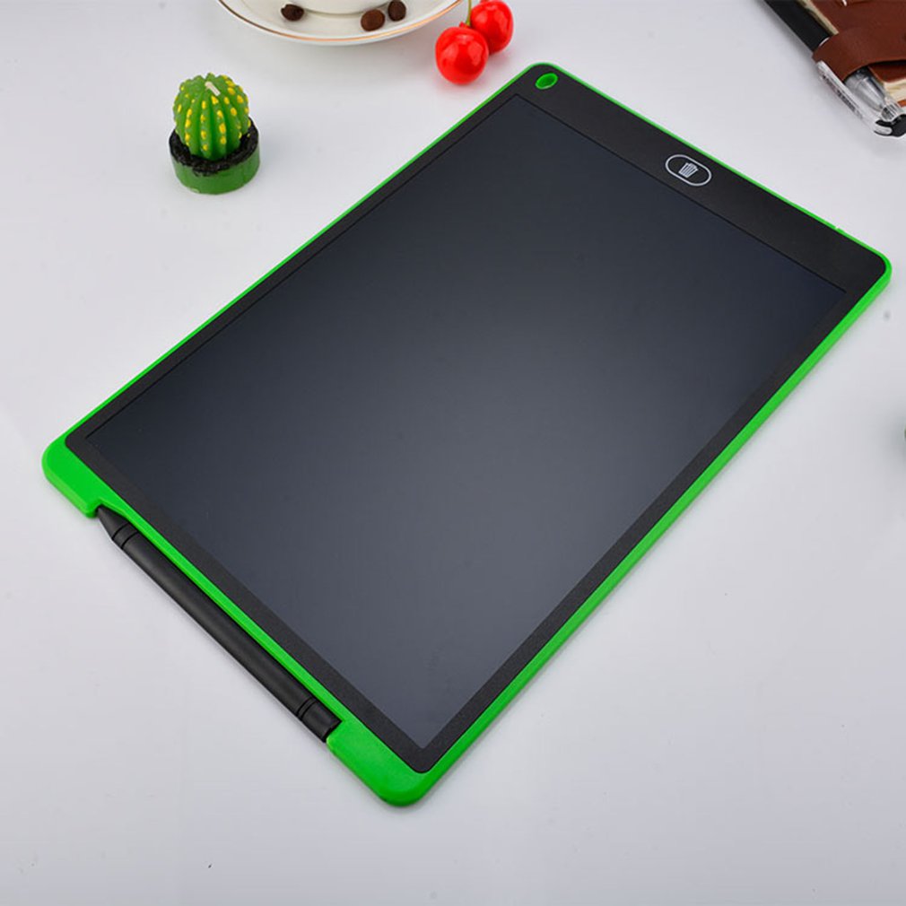 Green-framed electronic writing pad on a light gray surface with small decorative items.