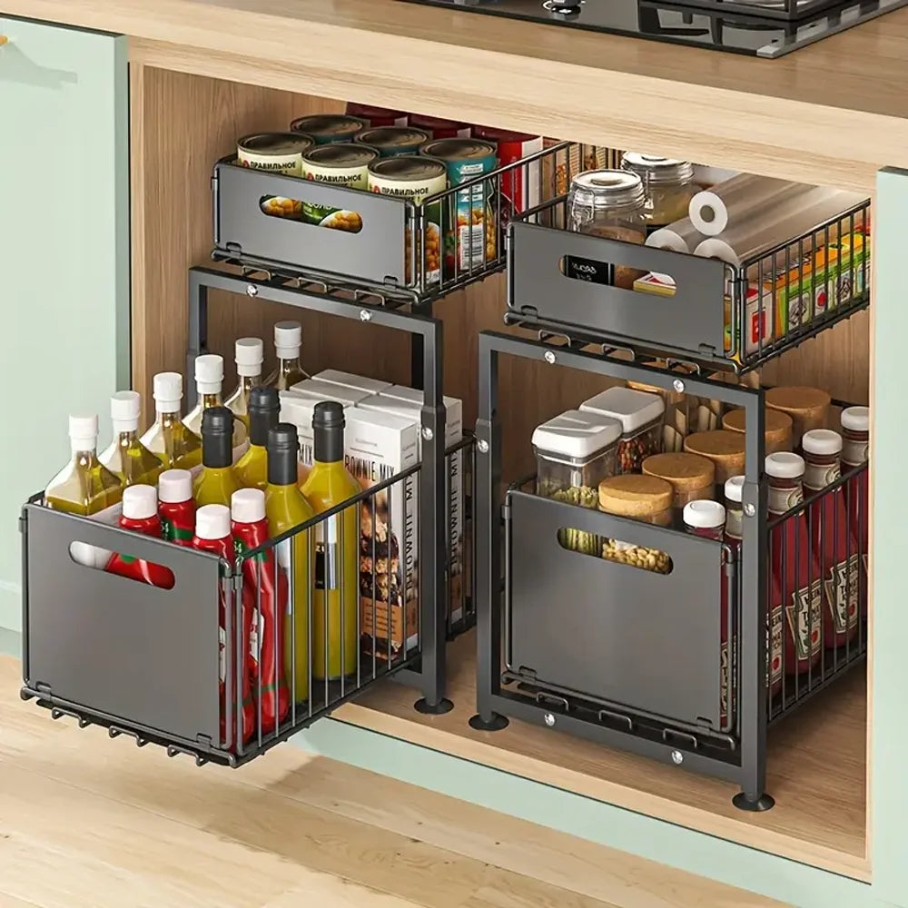 Kitchen cabinet with organized storage baskets containing food items.