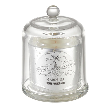 Glass jar with a lid containing a Gardenia home fragrance candle on a white background