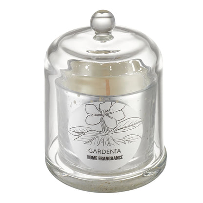 Glass candle holder with a white candle labeled 'Gardenia Home Fragrance' on a white background