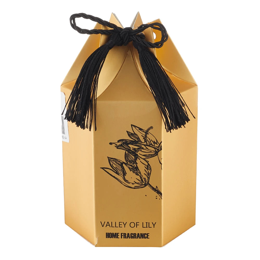 Gold packaging box with black tassels and 'Valley of Lily' branding on a white background