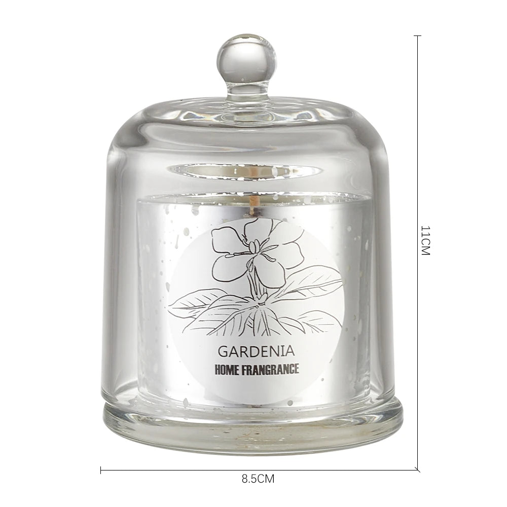 Glass candle with a lid featuring a gardenia design and dimensions on a white background
