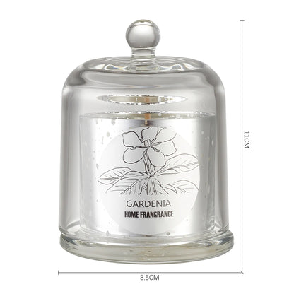 Glass candle with a lid featuring a gardenia design and dimensions on a white background