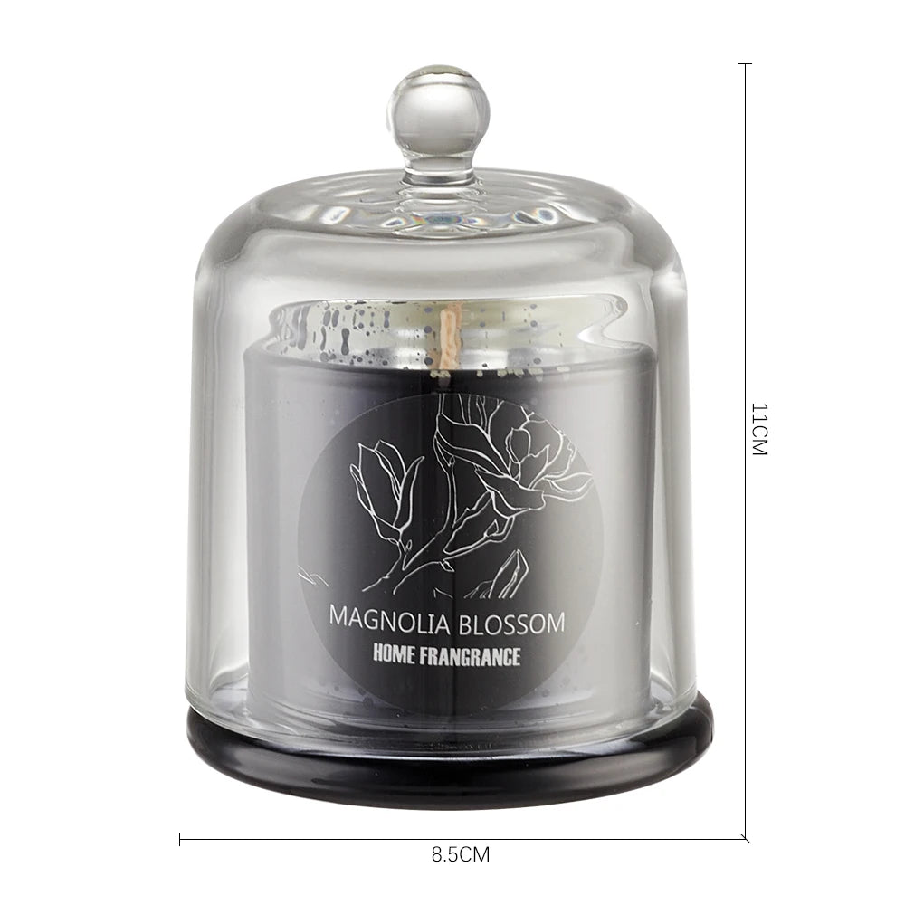 Glass dome candle with 'Magnolia Blossom Home Fragrance' label on a white background