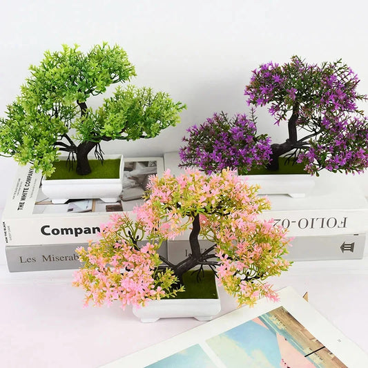 Artificial plants in pots on top of books with a white background