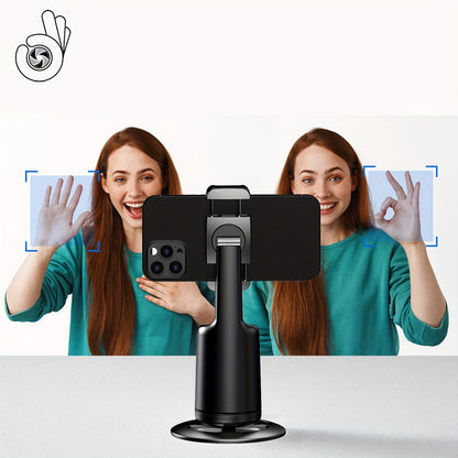 Woman holding a smartphone with a phone holder, with a reflection of herself on a white background.