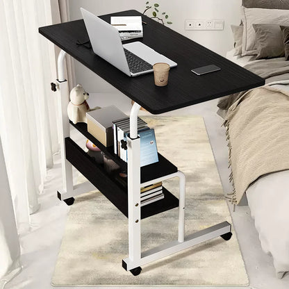 Black and white adjustable laptop desk in a bedroom setting.