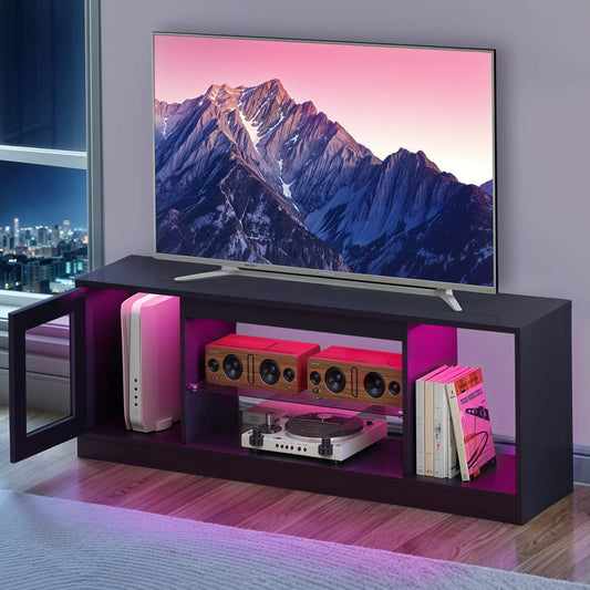Modern entertainment console with a TV displaying a mountain scene, in a room with cityscape view.