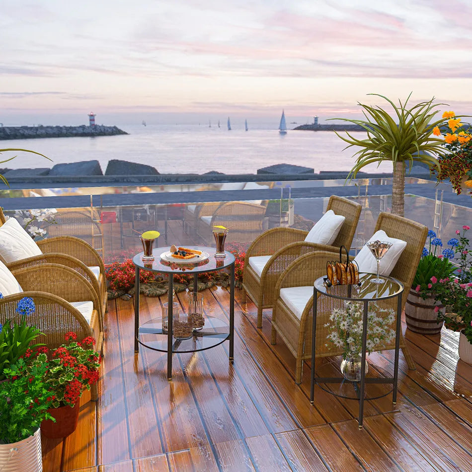 Outdoor deck with wicker furniture, table settings, and ocean view.