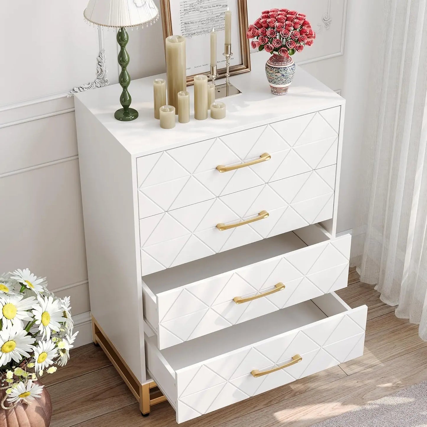 White dresser with gold handles in a room setting with decor items.