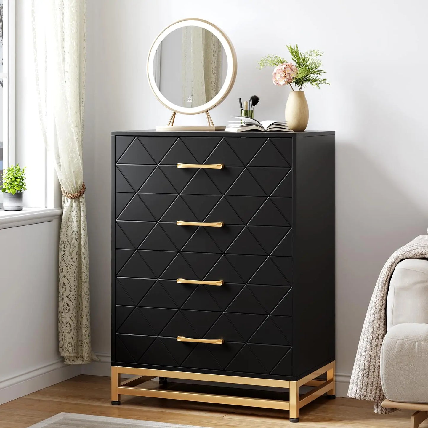 Black dresser with gold accents in a bedroom setting