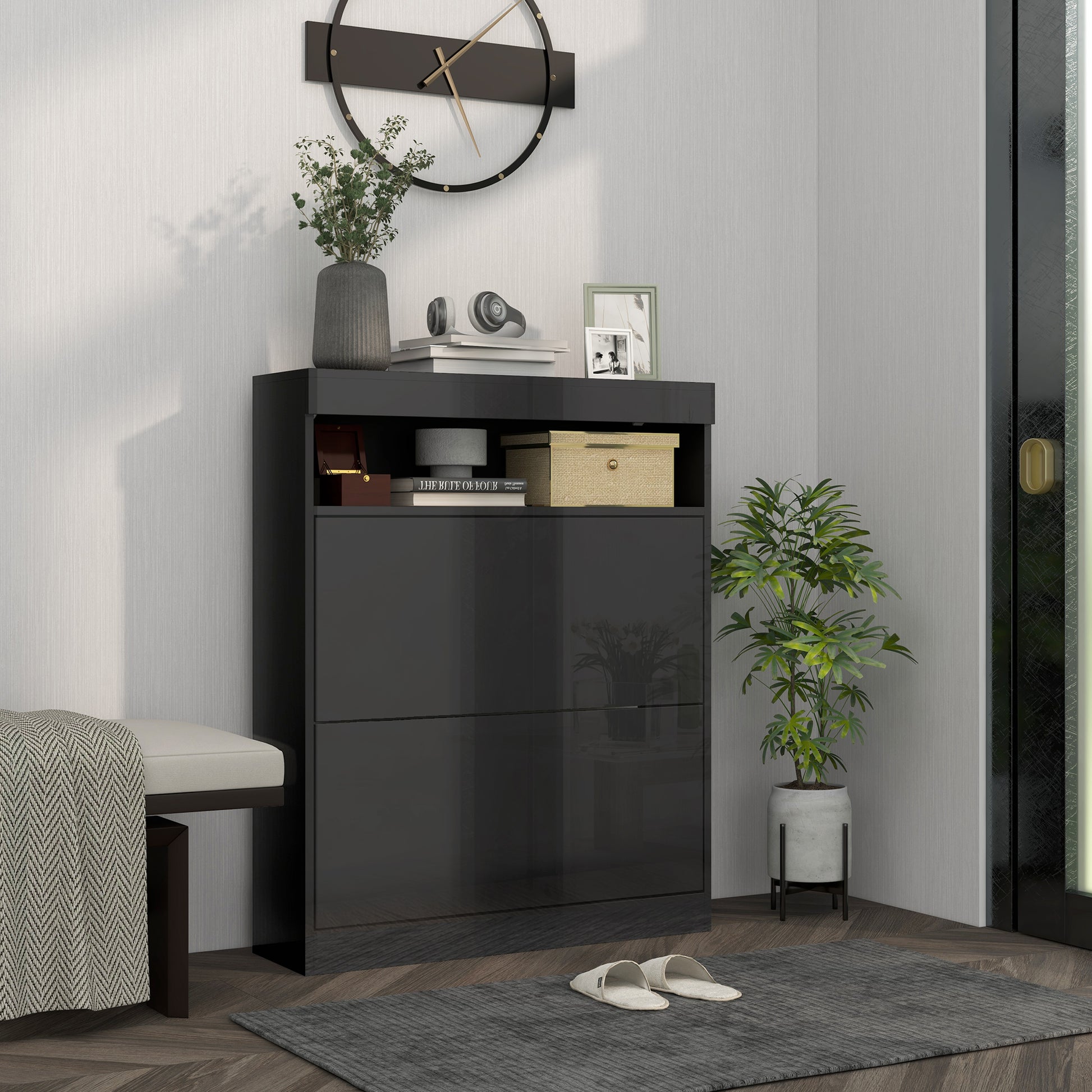 Modern interior with a dark gray shoe cabinet, plants, and a clock on the wall.