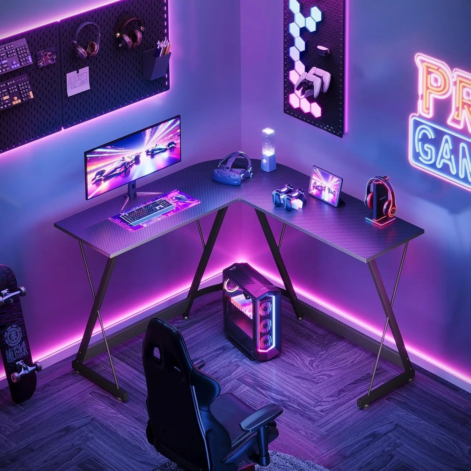 Gaming setup with a desk, computer equipment, and neon lights in a room.