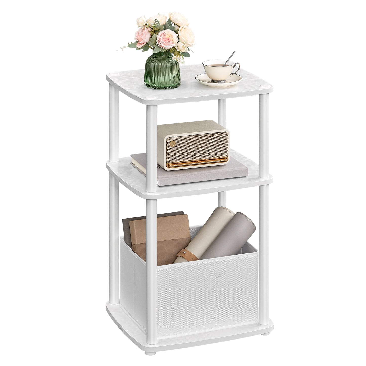 White three-tiered side table with decorative items on a white background