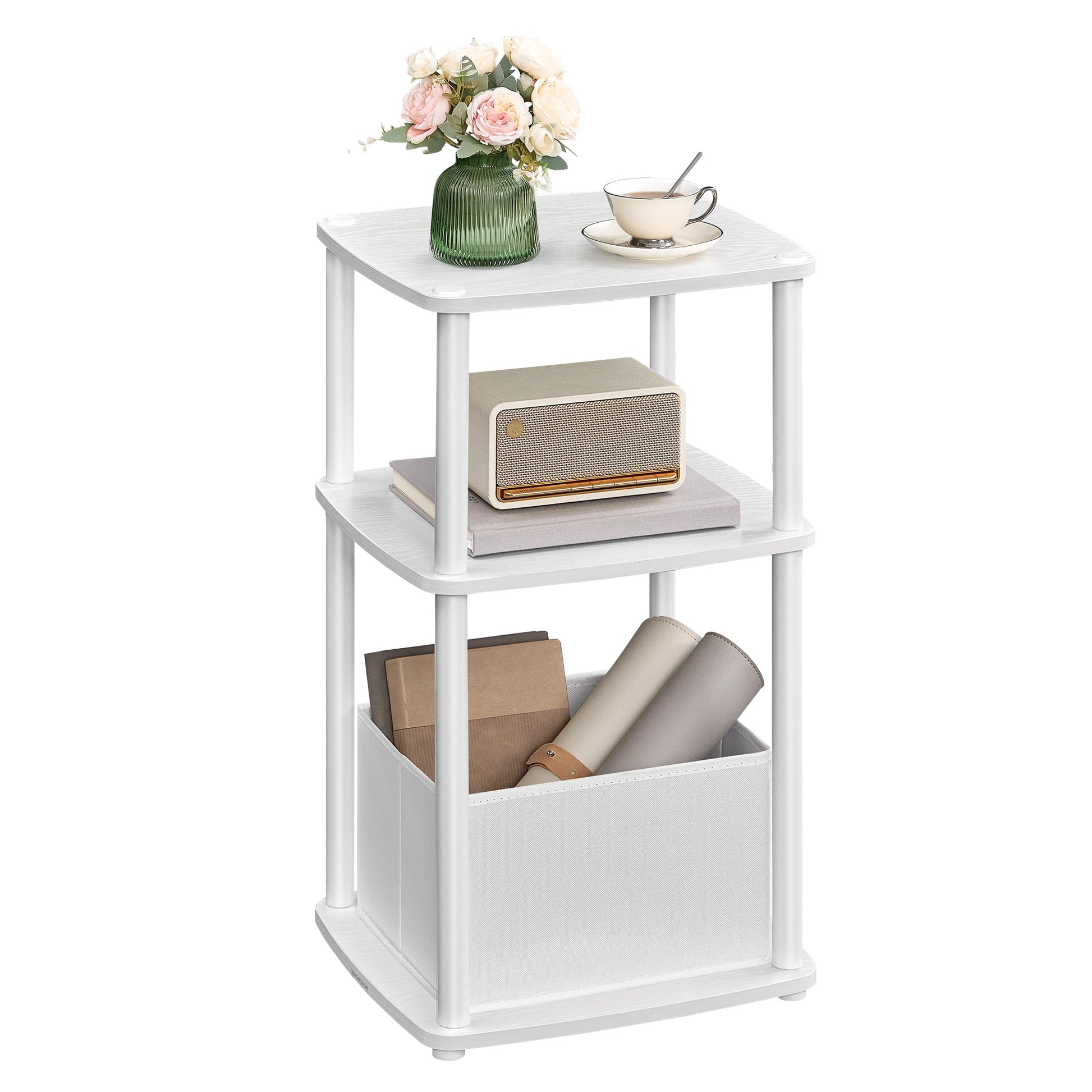 White three-tiered side table with decorative items on a white background