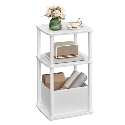 White three-tiered side table with decorative items on a white background