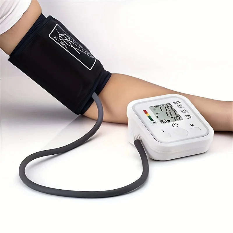 Blood pressure monitor with arm cuff on a white background