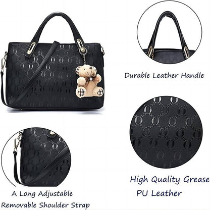 Black handbag with teddy bear charm, showing durable leather handle, high-quality grease PU leather, and adjustable shoulder strap.