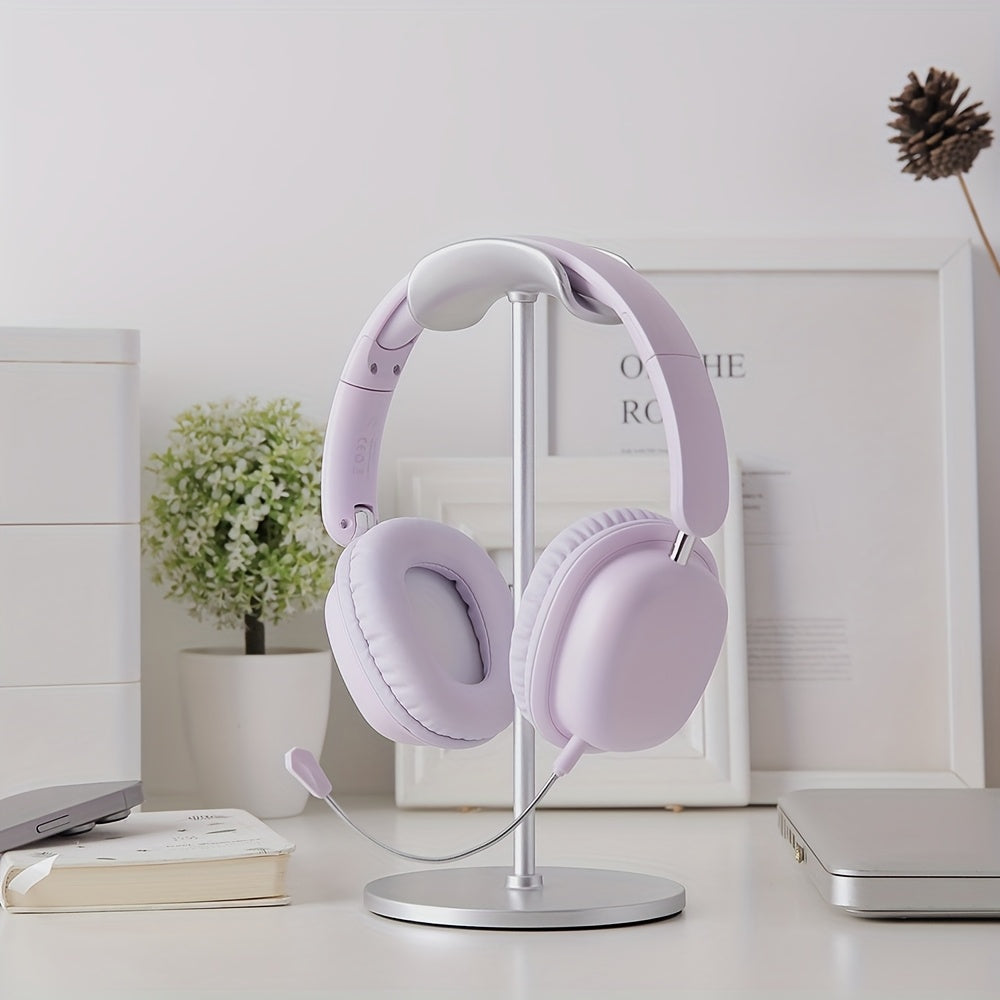 Lavender headphones on a stand with a minimal background