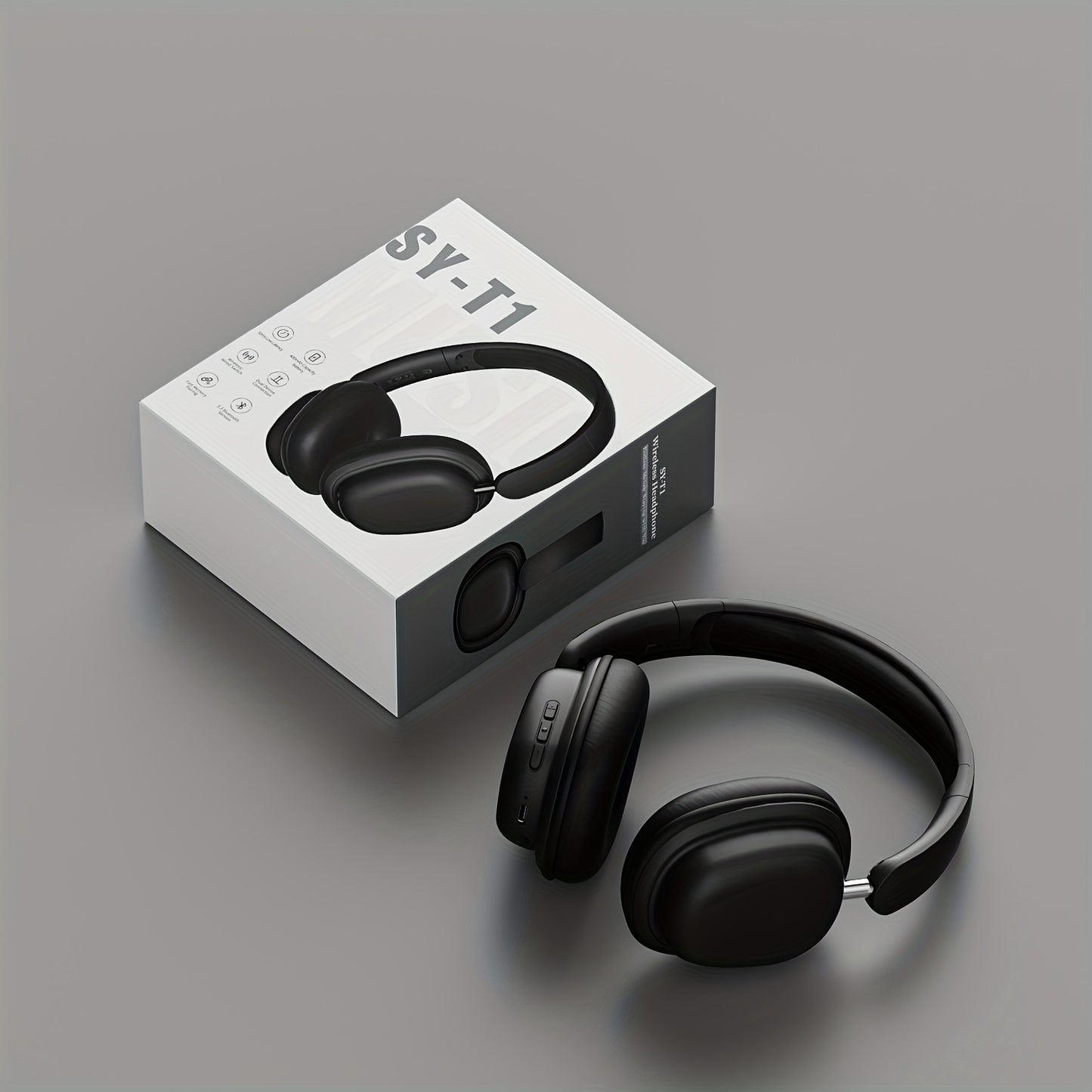 Black headphones with SY-T1 packaging on a gray background