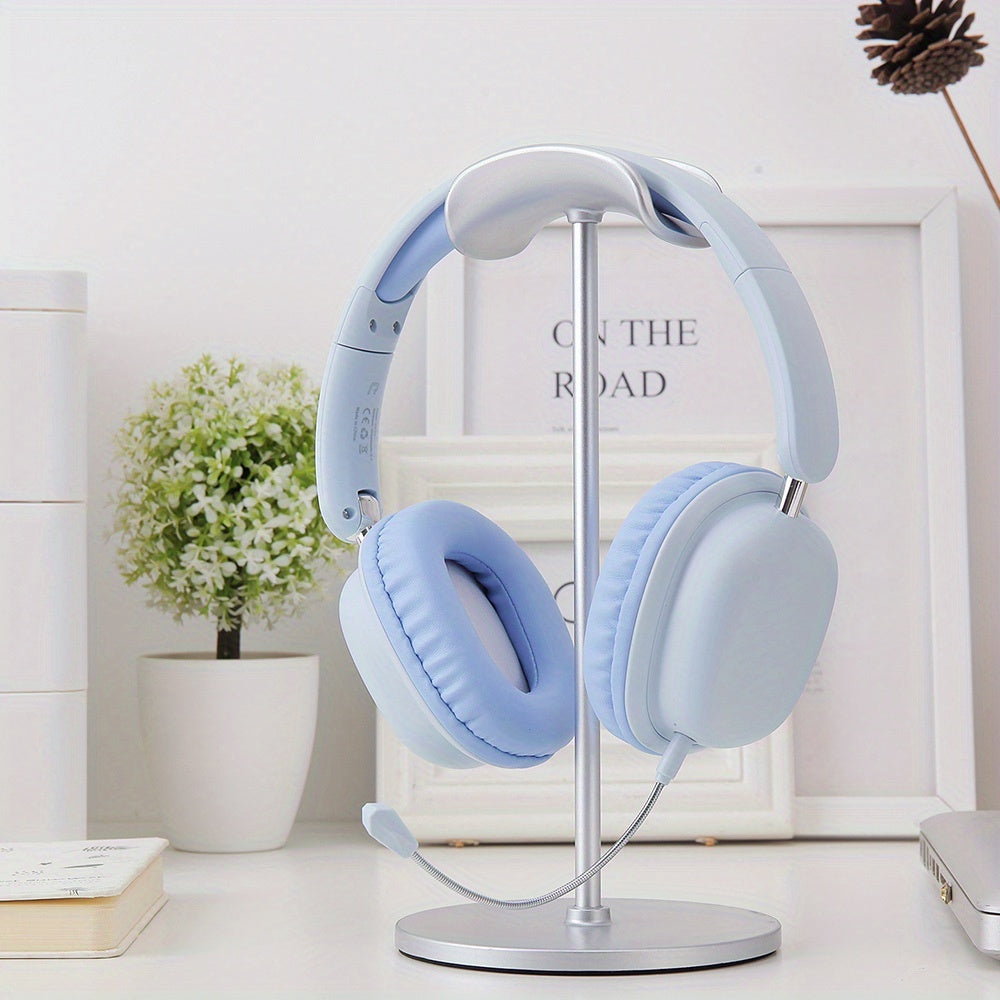 Light blue headphones on a stand with a white background