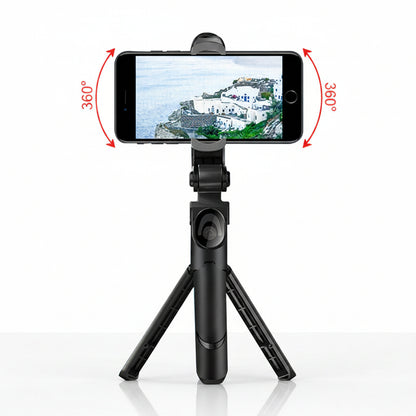 Black smartphone holder with tripod and phone displaying a scenic view on a white background