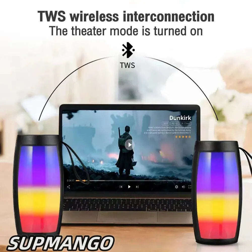 Two colorful TWS wireless speakers with a laptop displaying 'Dunkirk' on a blurred background.