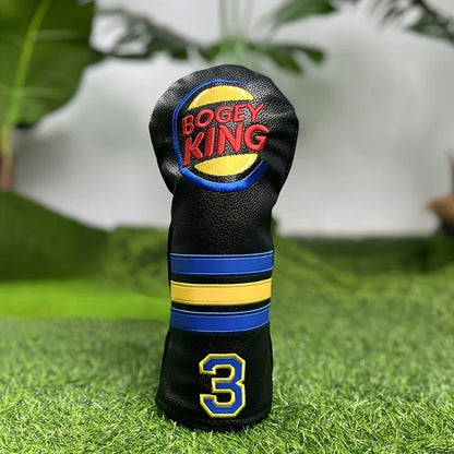 Golf club head cover with 'Bogey King' branding on a grass background