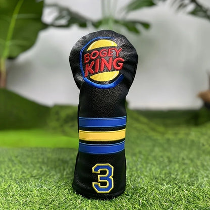 Golf club head cover with 'Bogey King' branding on a grass background