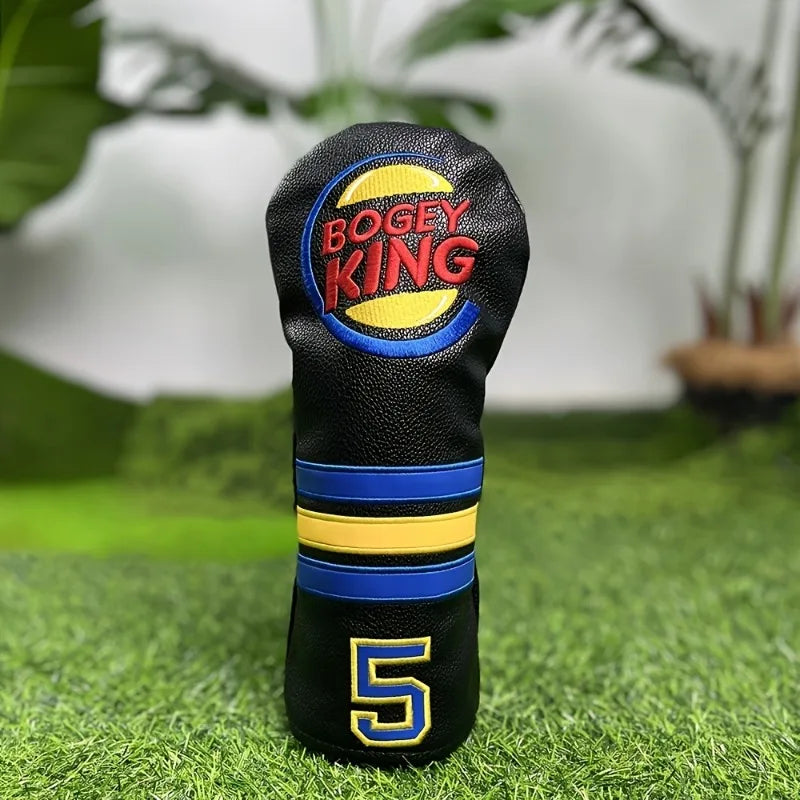 Golf club head cover with 'Bogey King' branding on a grass background