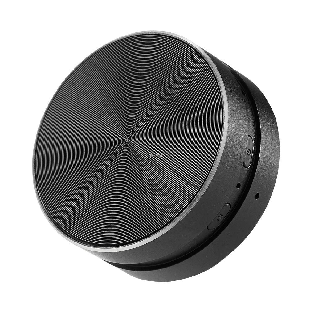 Black round speaker on a white background