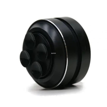 Black cylindrical object with a textured surface on a white background