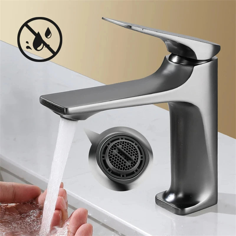 Chrome faucet with water flowing, set against a beige wall.