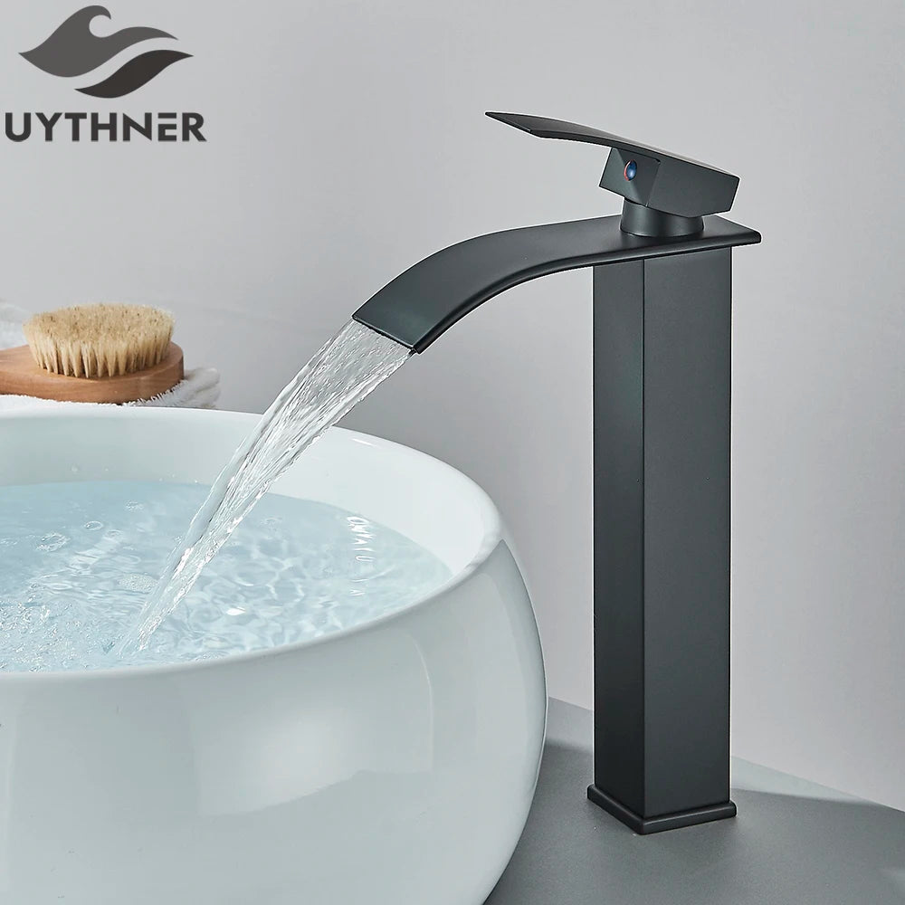 Black faucet pouring water into a white sink with 'UYTHNER' branding.