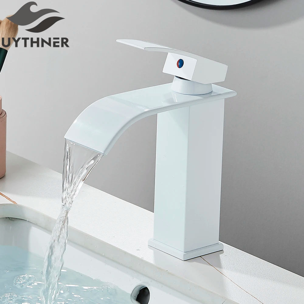 White bathroom faucet with water flowing, branded 'UYTHNER', on a gray background.
