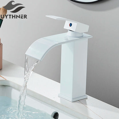 White bathroom faucet with water flowing, branded 'UYTHNER', on a gray background.