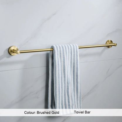 Gold towel bar with a striped towel on a tiled wall