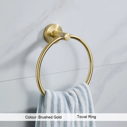 Gold towel ring with a striped towel on a tiled wall background