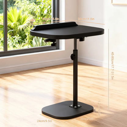 Black adjustable stand with a curved top in a room with a window and plants.
