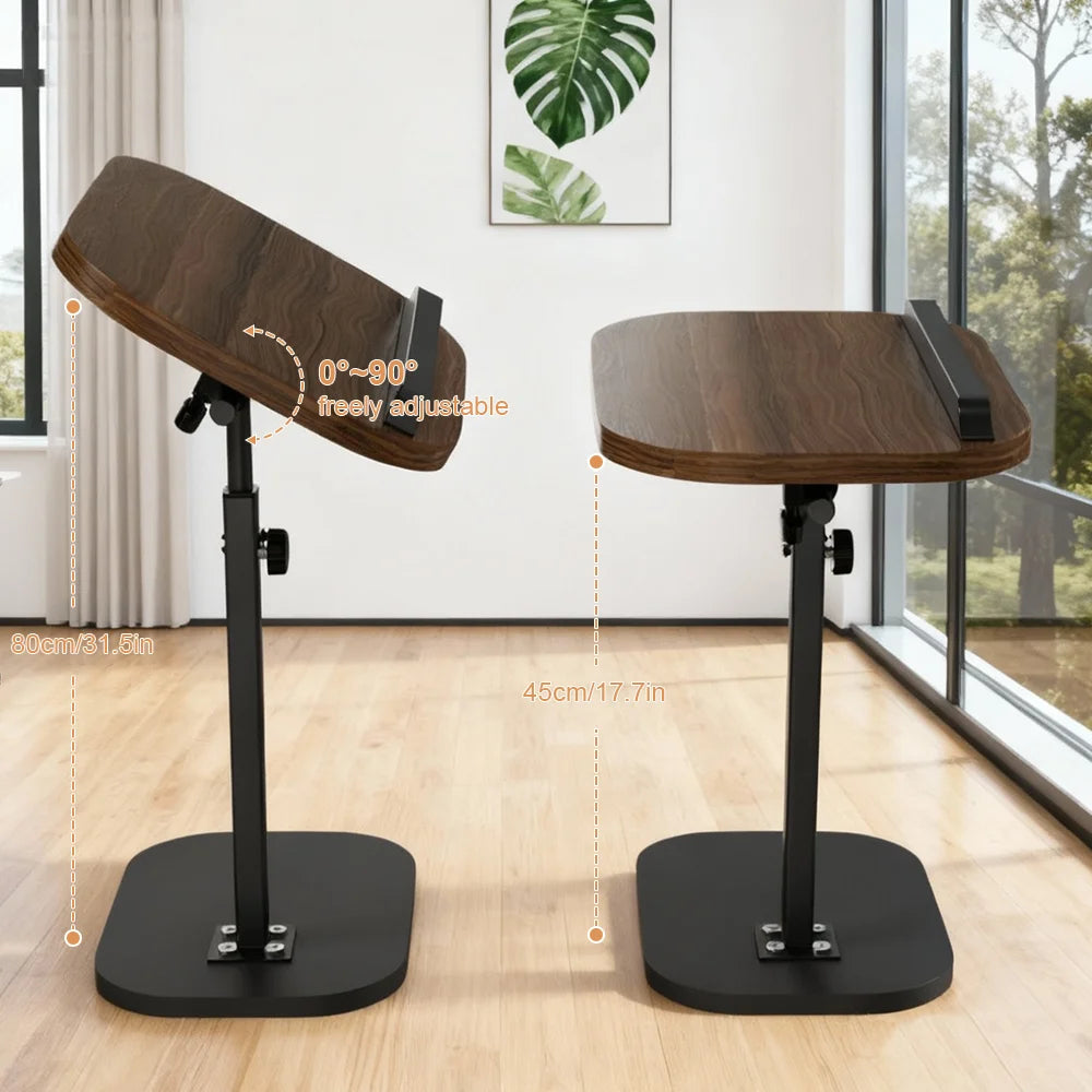 Two adjustable standing desks on a wooden floor with a window in the background.