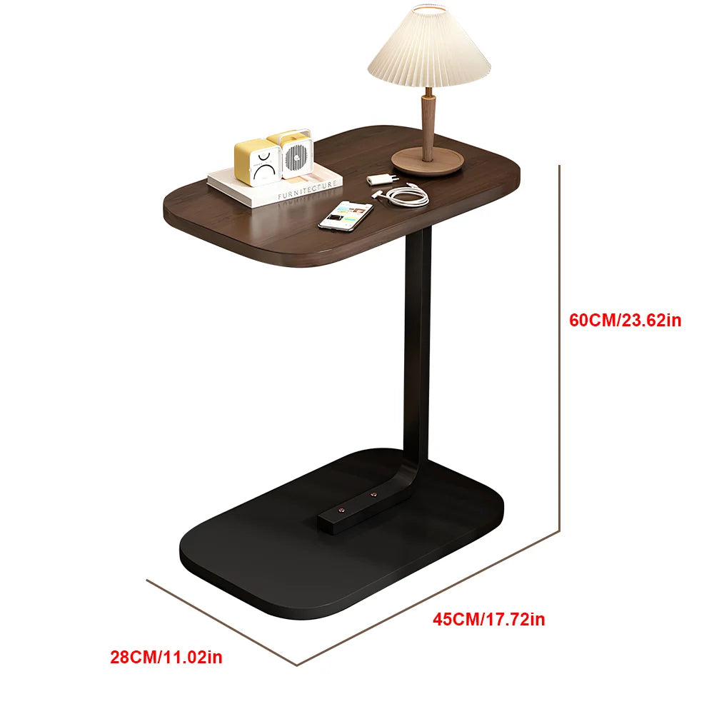 Small wooden side table with lamp and items, shown with dimensions on a white background