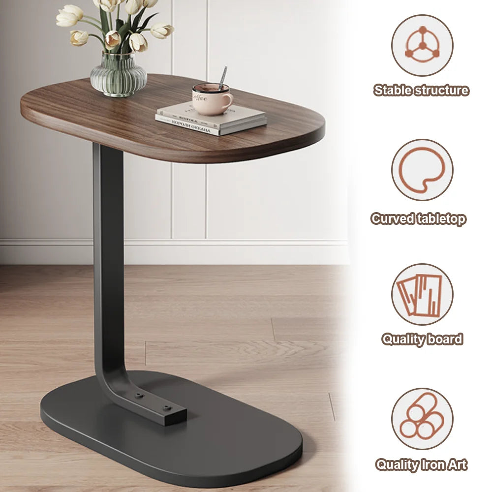 Side table with wooden top and black base on a light wood floor.