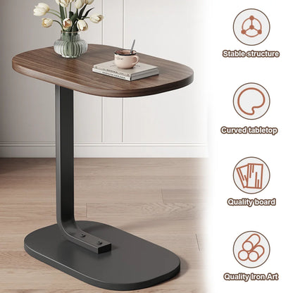 Side table with wooden top and black base on a light wood floor.