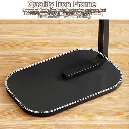 Black iron frame with decorative stitching on a wooden surface