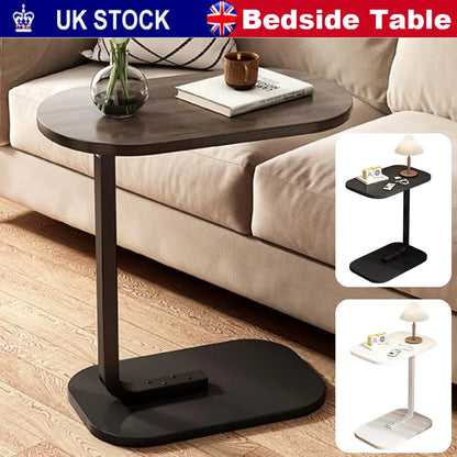 Black bedside table with a lamp and books on a beige sofa, with 'UK Stock' and 'Bedside Table' text.