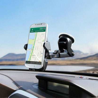 Phone mounted on a car dashboard with a scenic background