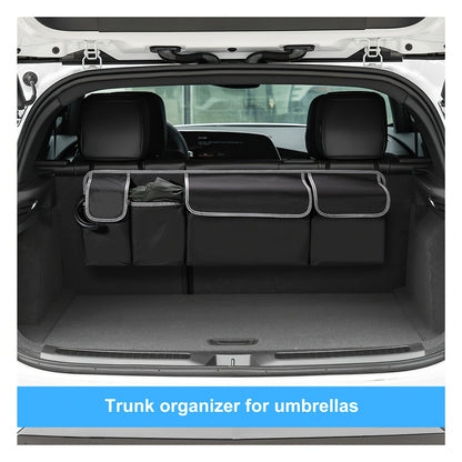 Trunk organizer for umbrellas installed in a car trunk.