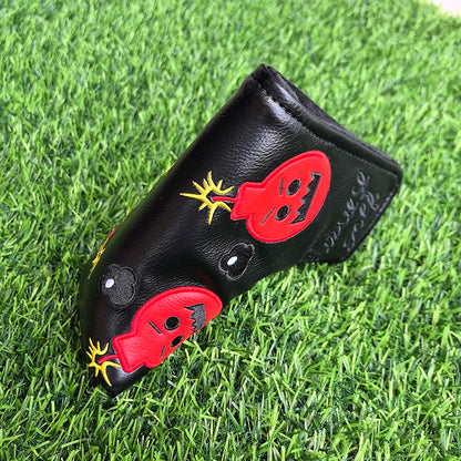 Golf club head cover with ladybug design on a grass background